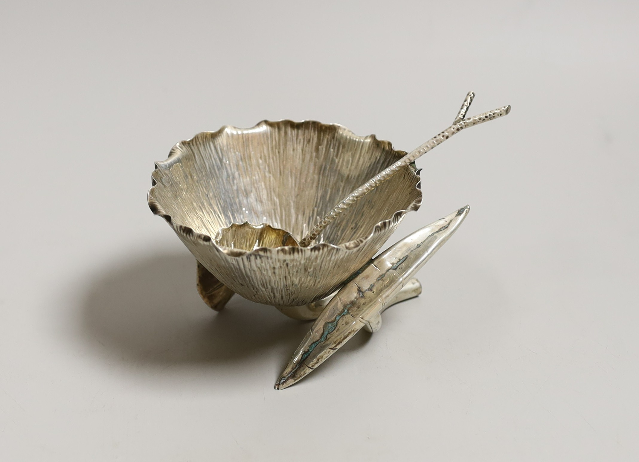 An Edwardian silver lotus shaped sugar bowl and matching sugar sifting spoon, by Hukin & Heath, London, 1902, bowl diameter 11.8cm, 7.5oz.